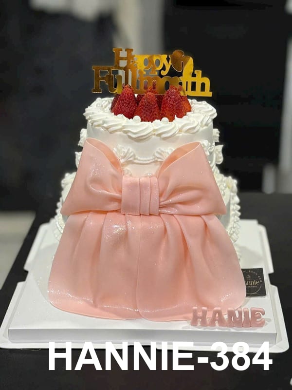 Bánh đầy tháng Hannie 2 tầng nơ hồng dâu tây tinh tế cho bé gái.